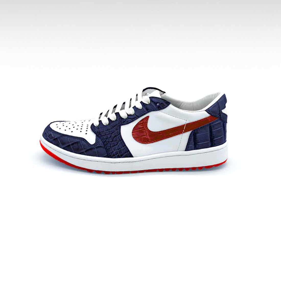 A pair of custom Air Jordans Golf Low sneakers in red, white, and blue color scheme, featuring exotic leather upper.