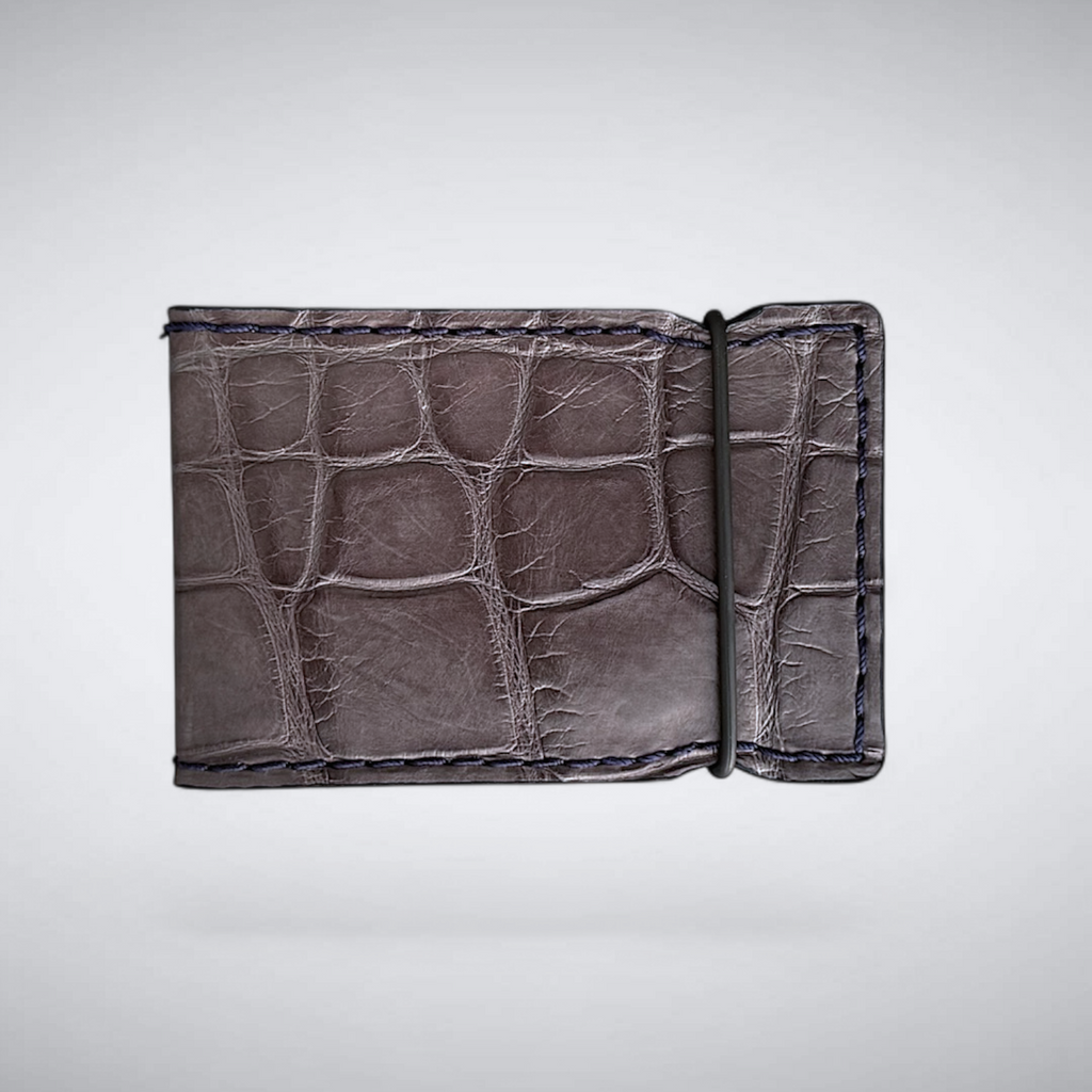 matte grey alligator cash cover wallet on light background